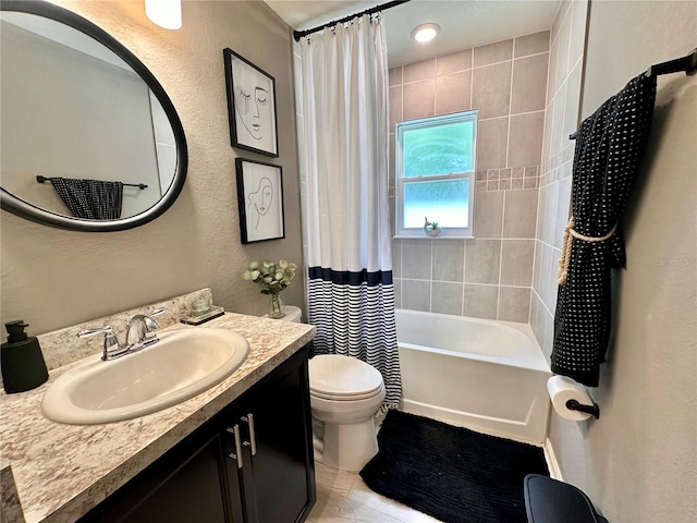 144 Foxtail Loop, Davenport, FL 33837 - bathroom with vanity, shower / bath combo with shower curtain, and a textured wall