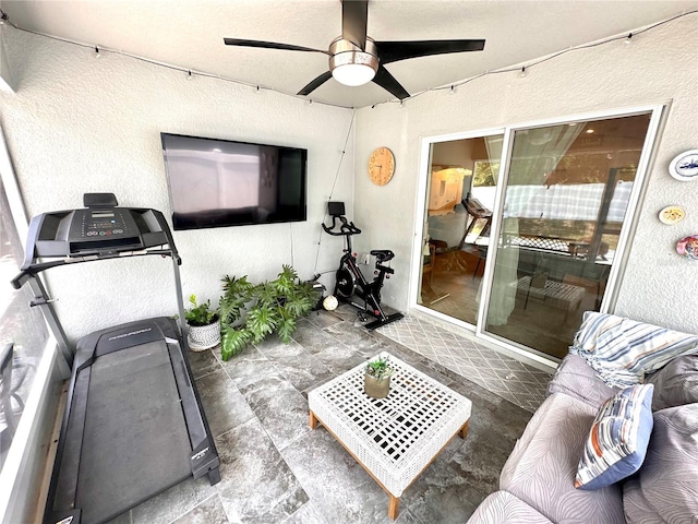 144 Foxtail Loop, Davenport, FL 33837 - exercise area with a textured wall and ceiling fan