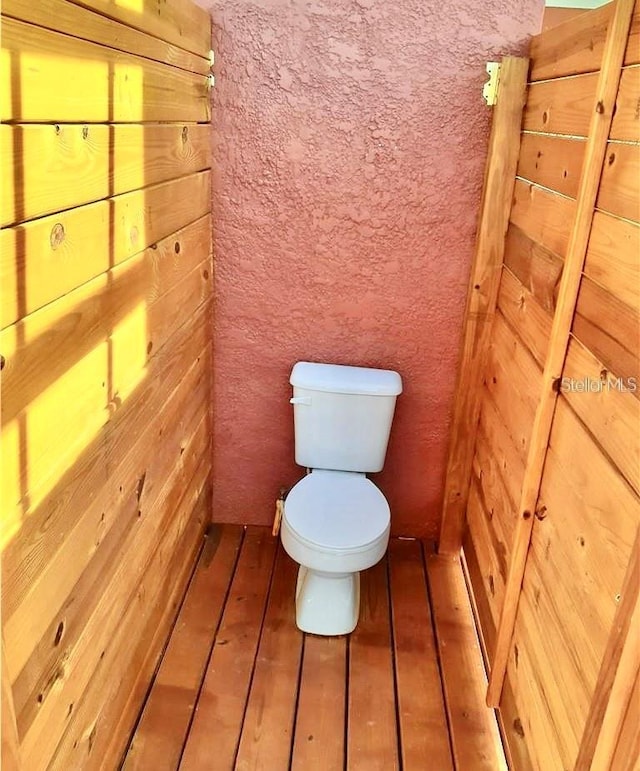 2576 R E Byrd Rd, Frostproof, FL 33843 - bathroom with toilet and hardwood / wood-style floors