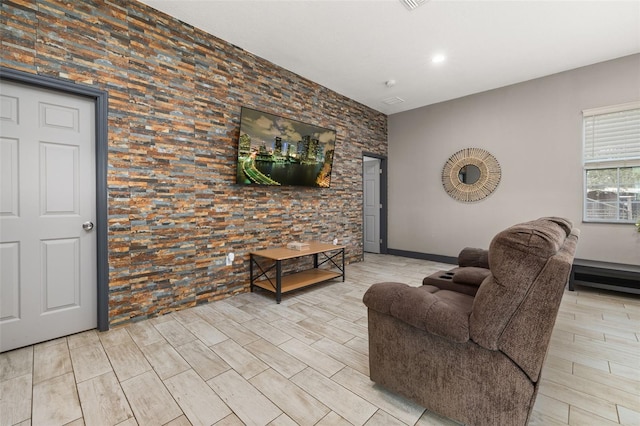 2576 R E Byrd Rd, Frostproof, FL 33843 - living room featuring light wood-style flooring, an accent wall, and recessed lighting