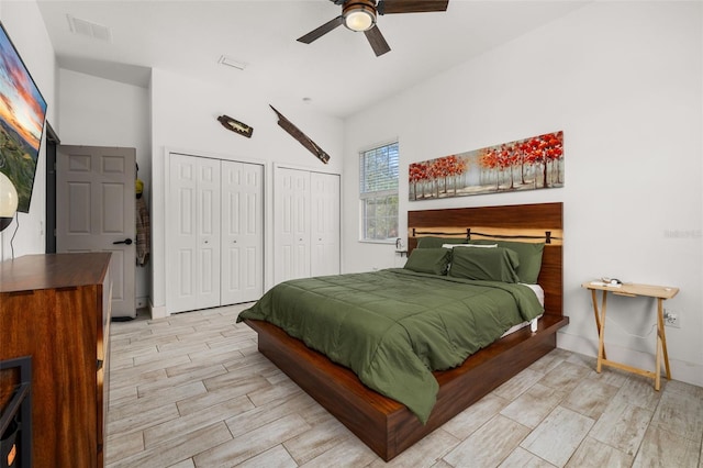 2576 R E Byrd Rd, Frostproof, FL 33843 - bedroom featuring multiple closets, wood finished floors, and a ceiling fan