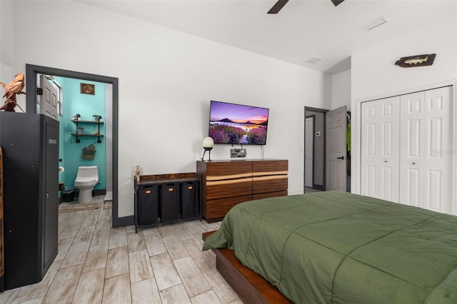 2576 R E Byrd Rd, Frostproof, FL 33843 - bedroom featuring light wood finished floors, a closet, ensuite bathroom, and ceiling fan