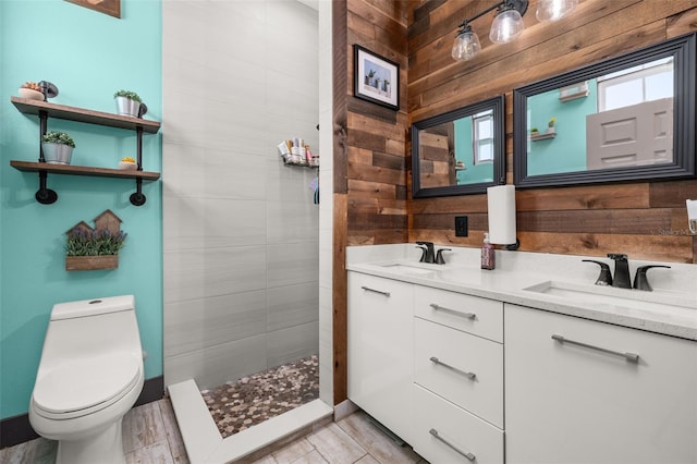 2576 R E Byrd Rd, Frostproof, FL 33843 - bathroom with double vanity, a tile shower, and wooden walls