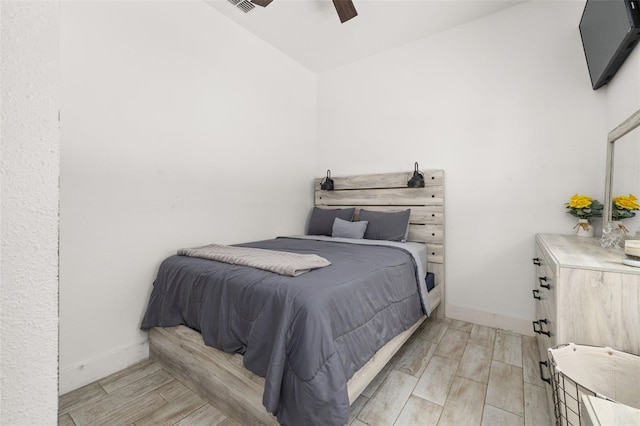 2576 R E Byrd Rd, Frostproof, FL 33843 - bedroom with light wood-style flooring, vaulted ceiling, and a ceiling fan