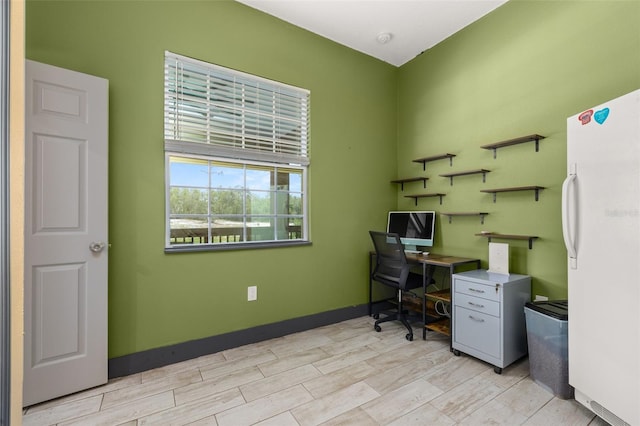 2576 R E Byrd Rd, Frostproof, FL 33843 - home office featuring light wood finished floors and baseboards