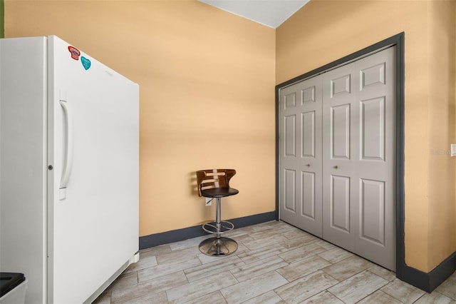 2576 R E Byrd Rd, Frostproof, FL 33843 - foyer entrance with light wood-type flooring and baseboards