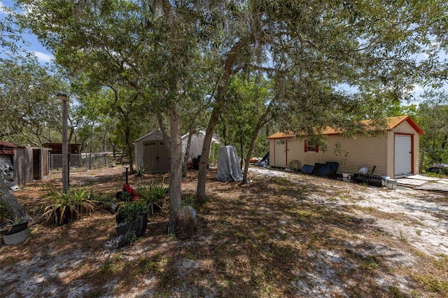 2576 R E Byrd Rd, Frostproof, FL 33843 - view of yard featuring a garage and a storage unit
