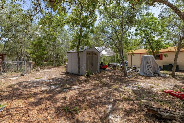 2576 R E Byrd Rd, Frostproof, FL 33843 - view of yard featuring a storage unit