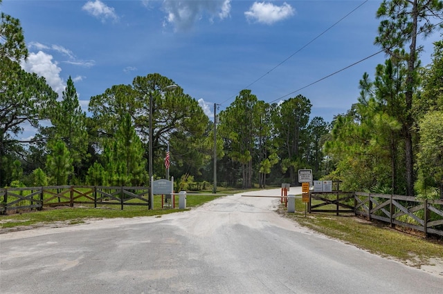 2576 R E Byrd Rd, Frostproof, FL 33843 - view of road with a gate and view of scattered trees