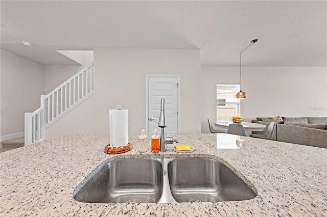 7413 Bent Tree Loop, Saint Cloud, FL 34771 - kitchen featuring light stone countertops, decorative light fixtures, and open floor plan