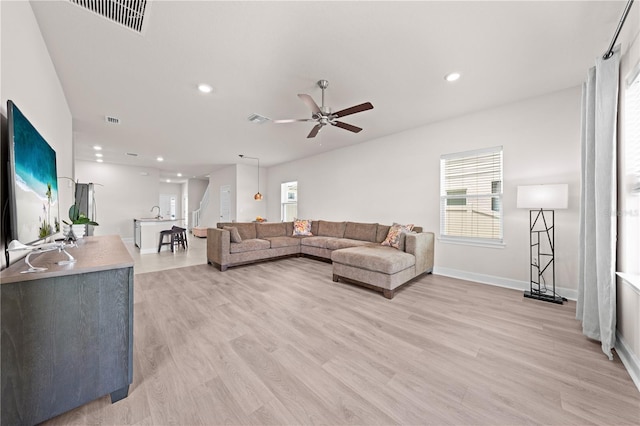 7413 Bent Tree Loop, Saint Cloud, FL 34771 - living area featuring light wood-style floors, a ceiling fan, and recessed lighting