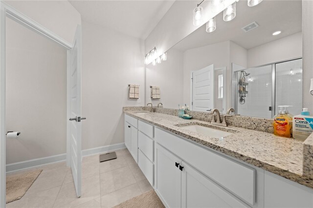 7413 Bent Tree Loop, Saint Cloud, FL 34771 - bathroom with double vanity, a shower stall, and tile patterned flooring
