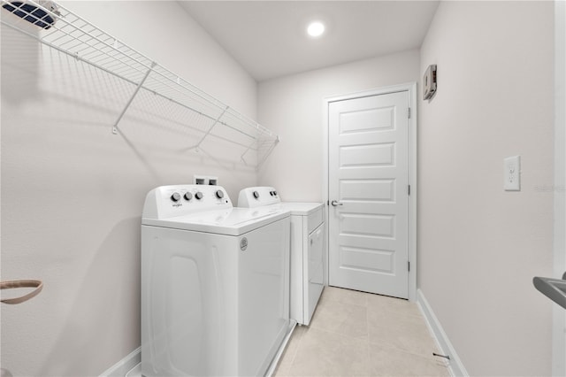 7413 Bent Tree Loop, Saint Cloud, FL 34771 - washroom with independent washer and dryer, light tile patterned floors, and recessed lighting