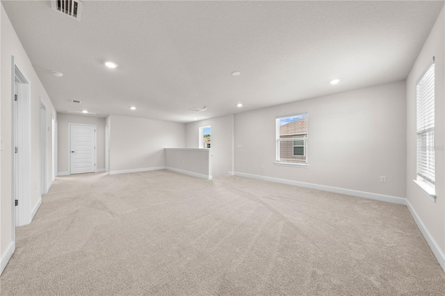 7413 Bent Tree Loop, Saint Cloud, FL 34771 - spare room with light carpet, recessed lighting, and plenty of natural light