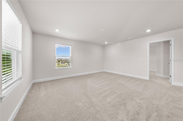7413 Bent Tree Loop, Saint Cloud, FL 34771 - spare room featuring healthy amount of natural light, light carpet, and recessed lighting