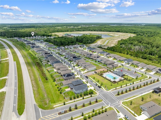 7413 Bent Tree Loop, Saint Cloud, FL 34771 - aerial view of residential area with a nearby body of water and a forest