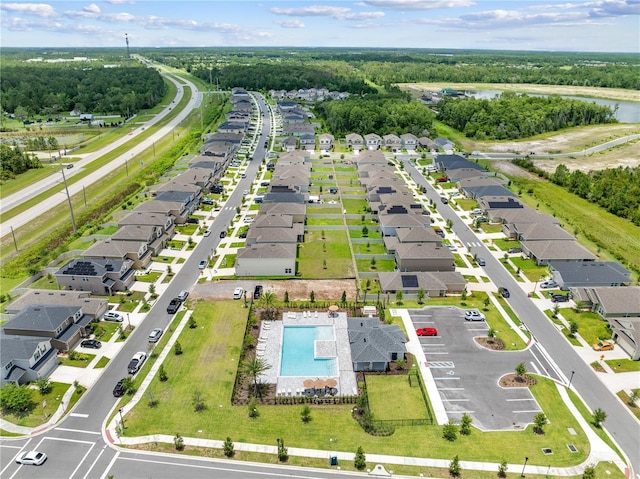 7413 Bent Tree Loop, Saint Cloud, FL 34771 - aerial perspective of suburban area featuring a pool and a nearby body of water