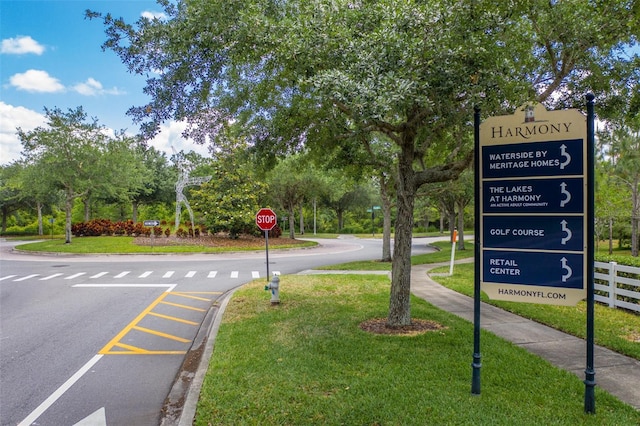 7413 Bent Tree Loop, Saint Cloud, FL 34771 - view of asphalt street with traffic signs, sidewalks, and curbs
