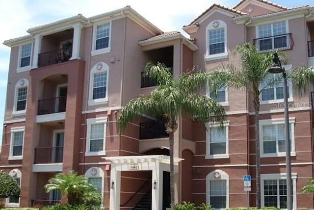 4862 Cayview Ave Unit 40409, Orlando, FL 32819 - view of building exterior with a garage