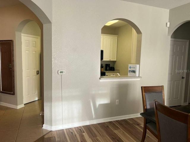 4862 Cayview Ave Unit 40409, Orlando, FL 32819 - kitchen with white cabinets, dark wood-type flooring, and light countertops
