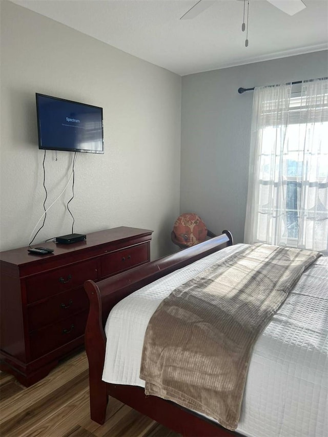 4862 Cayview Ave Unit 40409, Orlando, FL 32819 - bedroom featuring wood finished floors and ceiling fan
