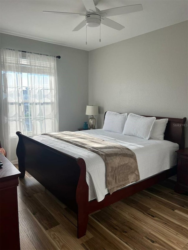 4862 Cayview Ave Unit 40409, Orlando, FL 32819 - bedroom with wood finished floors and ceiling fan