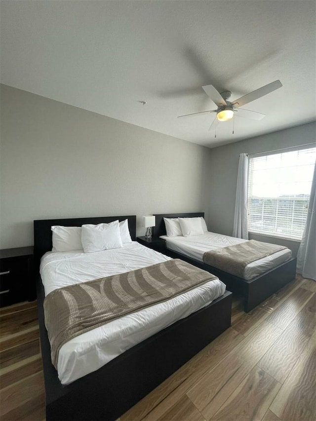 4862 Cayview Ave Unit 40409, Orlando, FL 32819 - bedroom featuring wood finished floors and ceiling fan