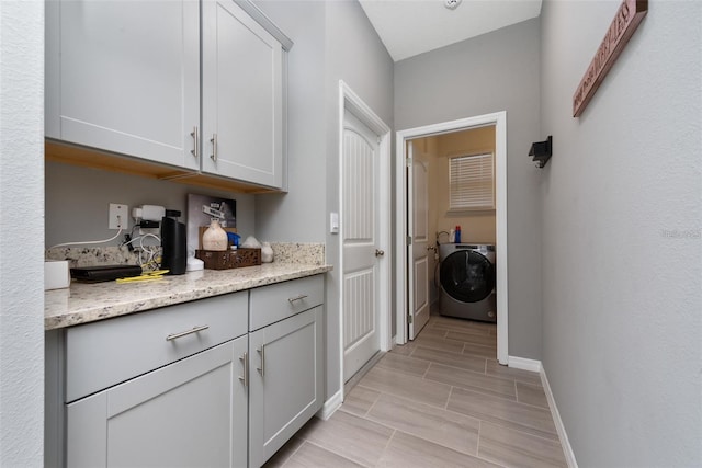 11051 Bostwick Aly, Winter Garden, FL 34787 - washroom featuring washer / dryer and wood finish floors