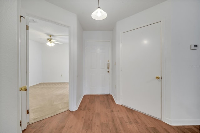 3205 Sabal Palms Ct Unit A, Kissimmee, FL 34747 - hallway with light wood-style flooring and baseboards