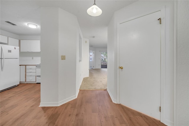 3205 Sabal Palms Ct Unit A, Kissimmee, FL 34747 - corridor featuring light wood finished floors and baseboards