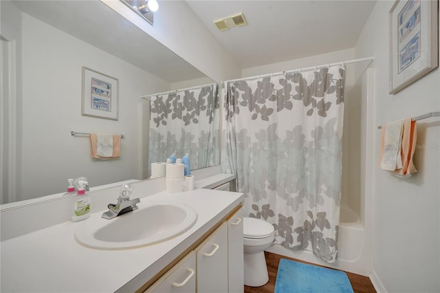 3205 Sabal Palms Ct Unit A, Kissimmee, FL 34747 - bathroom with vanity, shower / tub combo with curtain, and wood finished floors