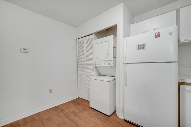 3205 Sabal Palms Ct Unit A, Kissimmee, FL 34747 - laundry room with estacked washer and dryer and light wood-type flooring