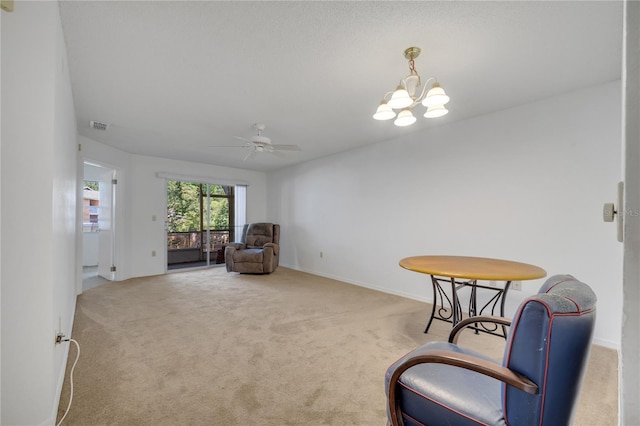 3205 Sabal Palms Ct Unit A, Kissimmee, FL 34747 - living area featuring carpet, ceiling fan, and a chandelier