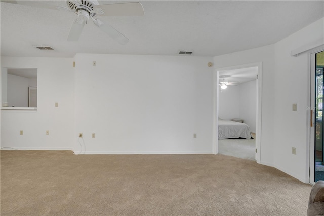 3205 Sabal Palms Ct Unit A, Kissimmee, FL 34747 - carpeted spare room featuring a ceiling fan and baseboards