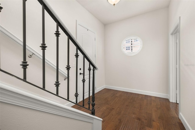 502 Mirasol Cir Unit 103, Kissimmee, FL 34747 - stairs featuring wood finished floors and baseboards