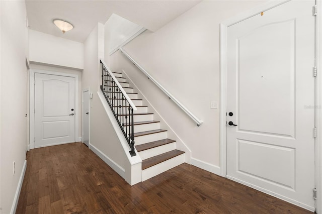 502 Mirasol Cir Unit 103, Kissimmee, FL 34747 - foyer with dark wood finished floors and stairway