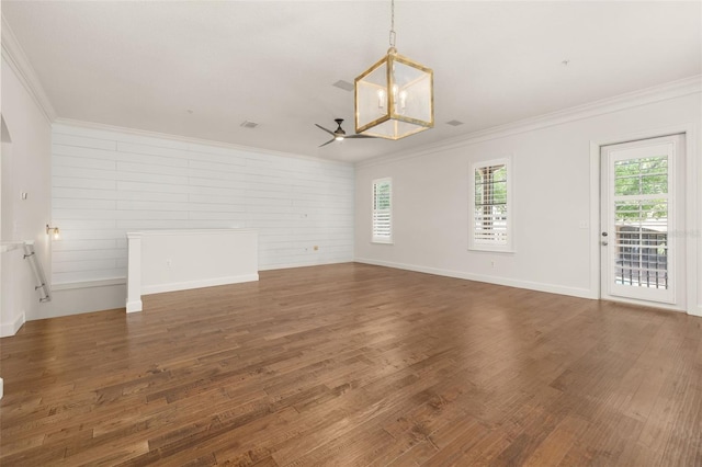 502 Mirasol Cir Unit 103, Kissimmee, FL 34747 - spare room featuring crown molding, wood finished floors, ceiling fan, and a chandelier