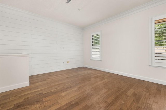 502 Mirasol Cir Unit 103, Kissimmee, FL 34747 - spare room with crown molding and wood finished floors