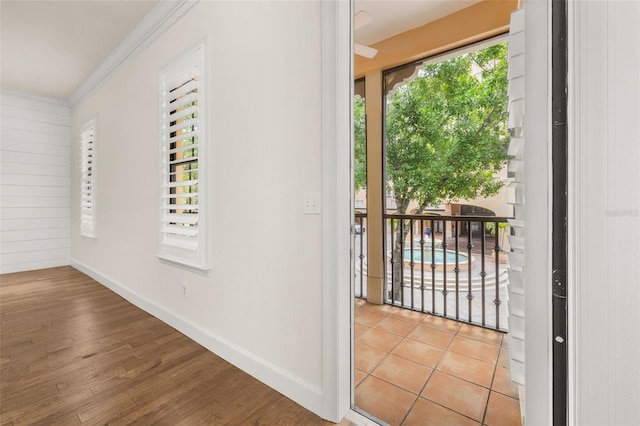 502 Mirasol Cir Unit 103, Kissimmee, FL 34747 - entryway featuring ornamental molding and wood finished floors