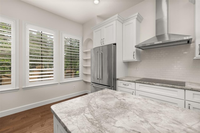 502 Mirasol Cir Unit 103, Kissimmee, FL 34747 - kitchen featuring wall chimney range hood, high quality fridge, black electric stovetop, and plenty of natural light