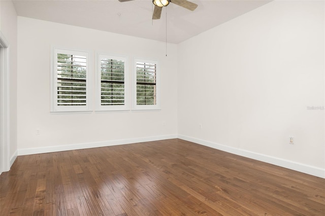 502 Mirasol Cir Unit 103, Kissimmee, FL 34747 - spare room with a ceiling fan and dark wood-type flooring