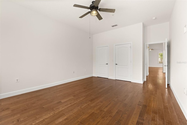 502 Mirasol Cir Unit 103, Kissimmee, FL 34747 - unfurnished bedroom with dark wood-type flooring, two closets, and a ceiling fan