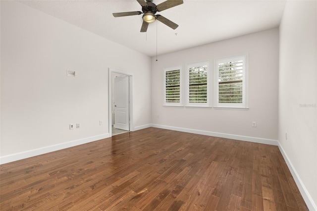 502 Mirasol Cir Unit 103, Kissimmee, FL 34747 - empty room with dark wood-style flooring and a ceiling fan