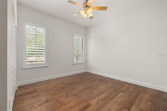 502 Mirasol Cir Unit 103, Kissimmee, FL 34747 - unfurnished room featuring dark wood finished floors, healthy amount of natural light, and ceiling fan