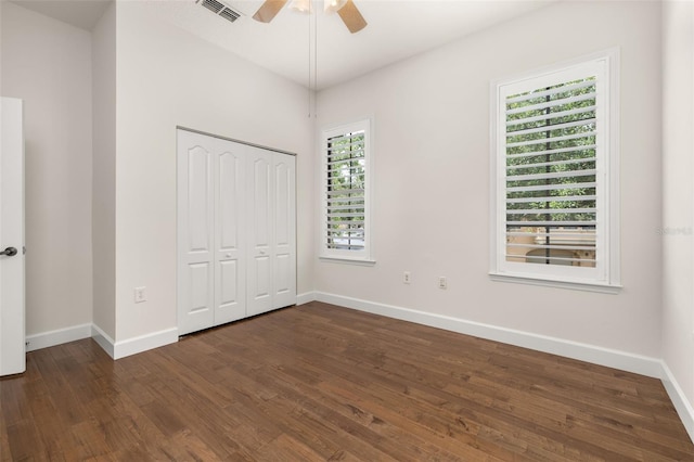 502 Mirasol Cir Unit 103, Kissimmee, FL 34747 - unfurnished bedroom featuring wood finished floors, a closet, and a ceiling fan
