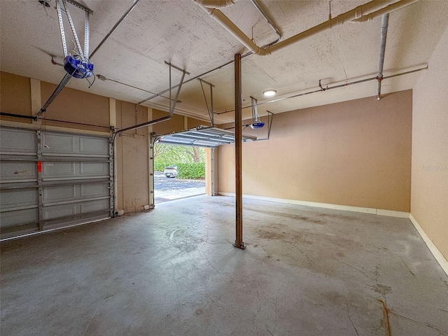 502 Mirasol Cir Unit 103, Kissimmee, FL 34747 - garage featuring a garage door opener