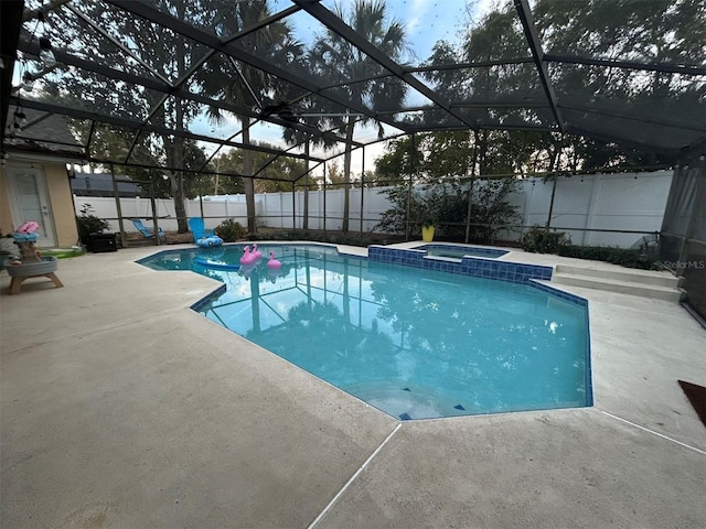 4820 Wingrove Blvd, Orlando, FL 32819 - view of swimming pool with a fenced backyard, a patio area, a pool with connected hot tub, and a lanai