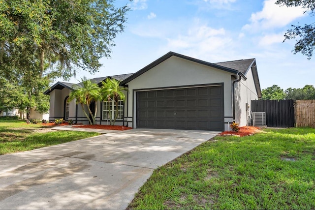 6528 Shepherd Oaks Pass, Lakeland, FL 33811 - ranch-style house with stucco siding, a garage, and driveway