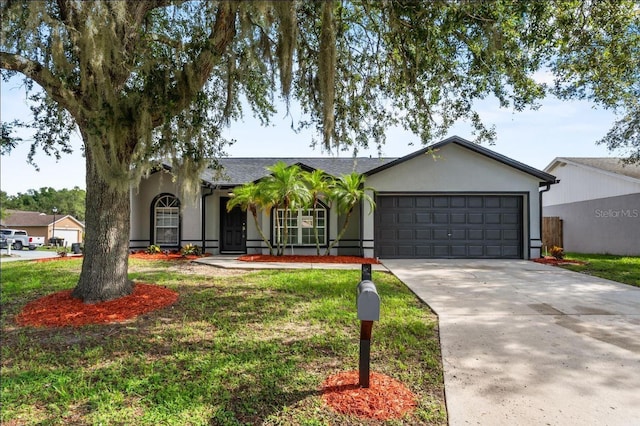 6528 Shepherd Oaks Pass, Lakeland, FL 33811 - single story home with concrete driveway, an attached garage, stucco siding, and a front yard