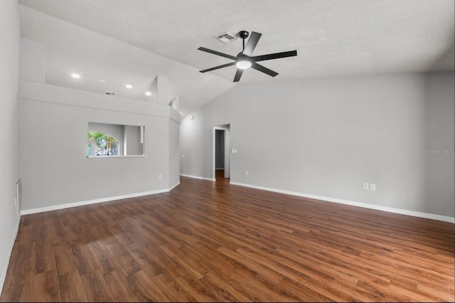 6528 Shepherd Oaks Pass, Lakeland, FL 33811 - spare room featuring ceiling fan, vaulted ceiling, dark wood finished floors, and a textured ceiling